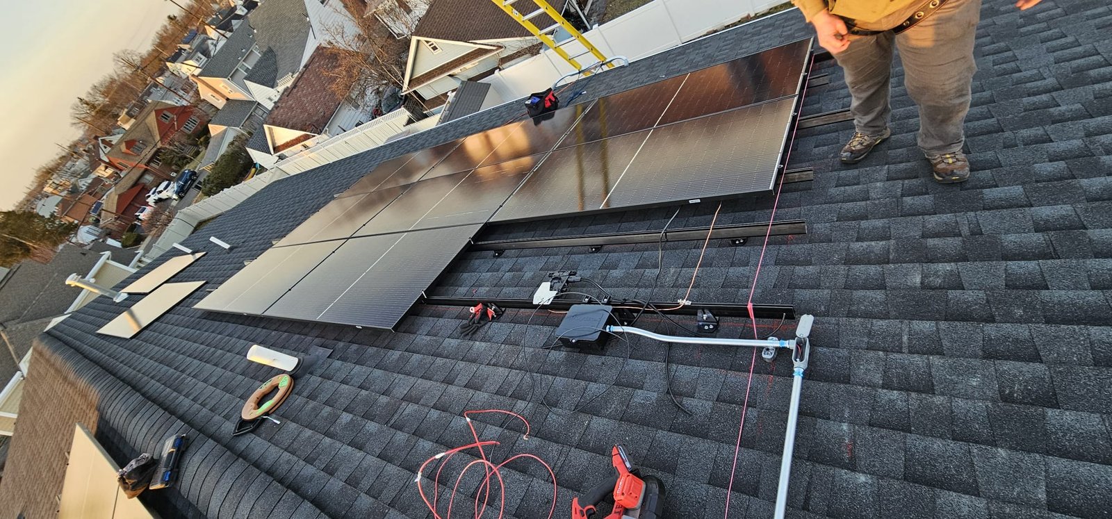 Simple Energy Systems technicians working on a roof